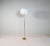 A gorgeous floor lamp made in brass with time glass shaped rod. Produced for asea this wonderful lamp was most likely...