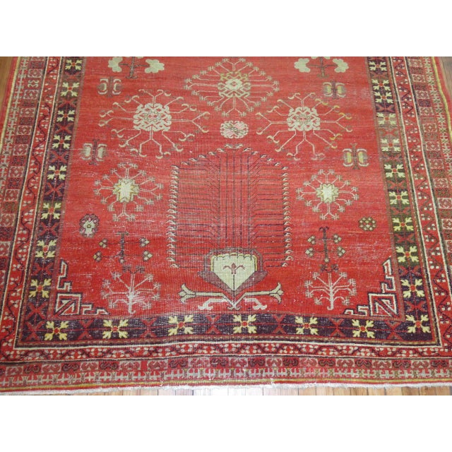An early 20th century predominantly Khotan gallery rug. 6'4'' x 12'11''