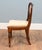 A handsome set of six Victorian mahogany dining chairs with elegant balloon backs Each shaped back has a carved cross rail...