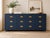 Authentic Drexel Campaign collection * Nine dovetailed drawers with brass campaign pulls * Professionally refinished in...