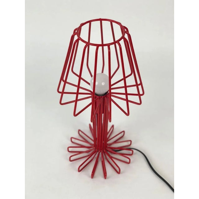 This table lamp is made in solid metal, red lacquered for one light with 25 Watt. Up to 250V (Europe/UK Standard).The...