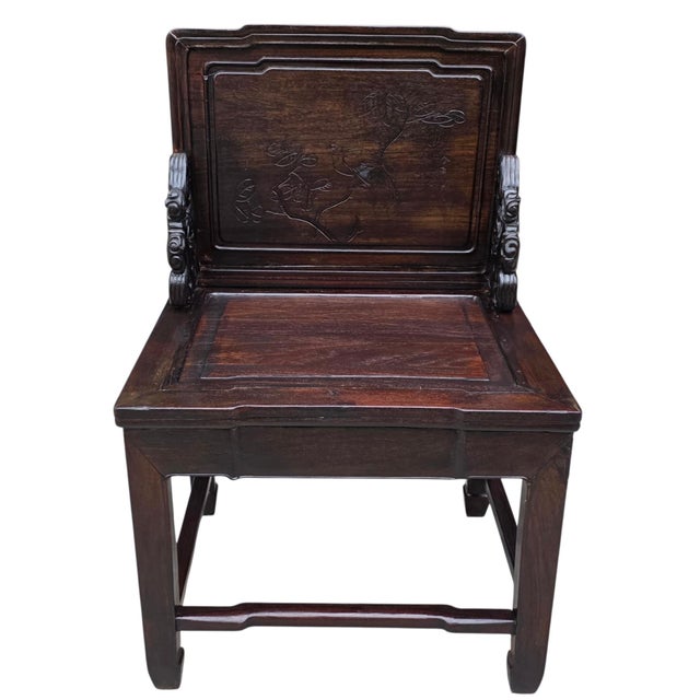 Chinese scholar’s chair dates to the Late Qing Dynasty, circa 1880–1910, and is crafted in richly grained dark hongmu, a...