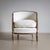 Art Deco armchair in limed oak with rounded backrests and conical legs. The chair was reupholstered in an off-white fabric.