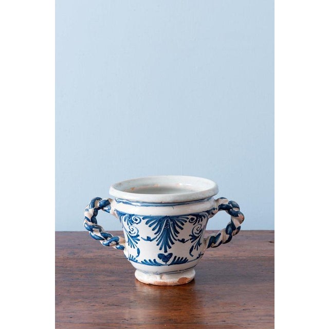 Height: 11 cm Diameter: 15 cm / 17 cm. Very light wear throughout. Minor glaze losses to one handle, to one base, and to...