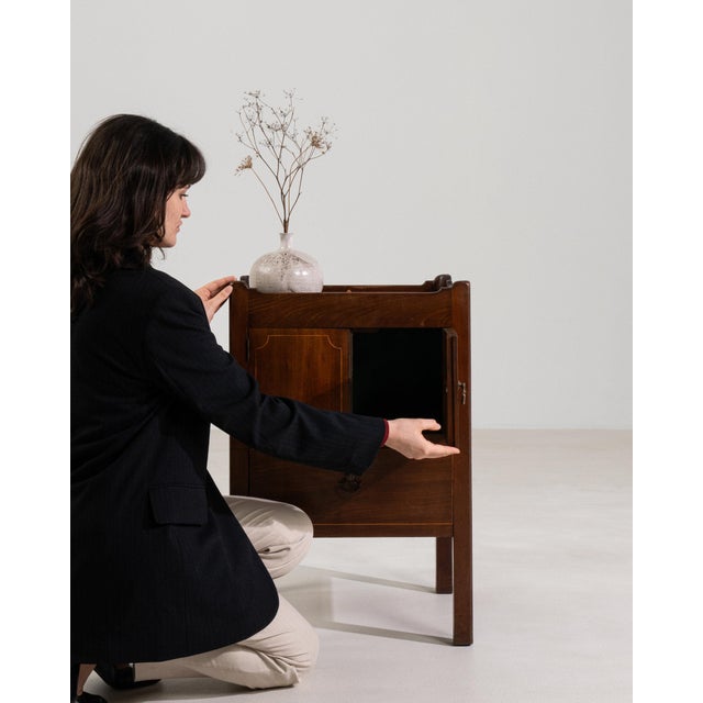 This piece presents as a piece, distinguished by medium brown wood, paneled. The piece dates to 20th Century, sourced from...