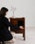 This piece presents as a piece, distinguished by medium brown wood, paneled. The piece dates to 20th Century, sourced from...