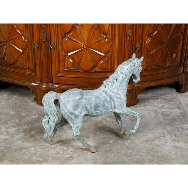 A French bronze horse statue from the mid 20th century, with great details and patina. Created in France during the...