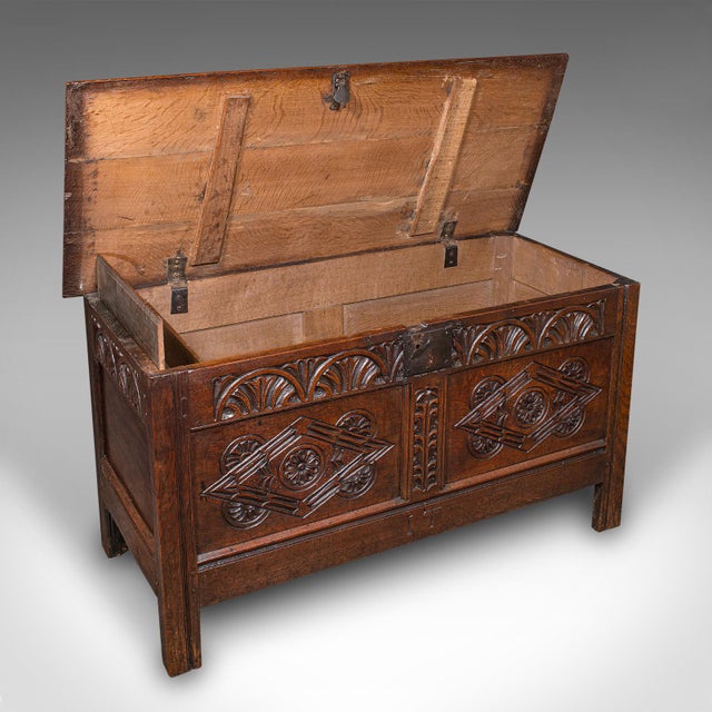 This is a large antique carved coffer. An English, oak blanket or linen chest, dating to the William III period, circa...