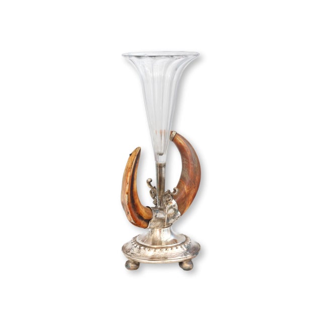 Striking Victorian centerpiece vase featuring a fluted glass trumpet mounted in a silverplate base framed by dramatic...