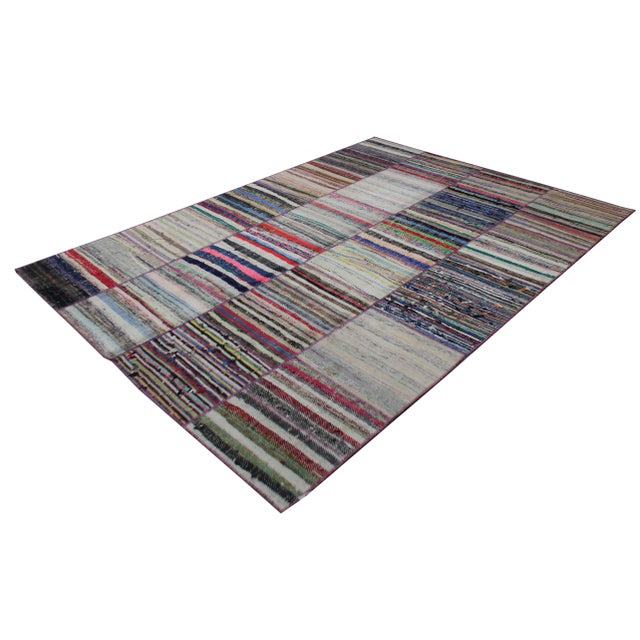 A beautiful antique Patchwork rug. It's in very good condition, practically new. This Patchworks rug is produced of older...