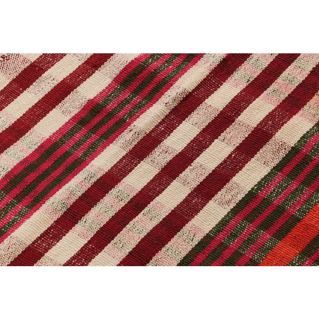 This vintage 5x6 Persian kilim is a mid-century Qashqai tribal rug, handwoven in wool circa 1950-1960. On the Design: This...