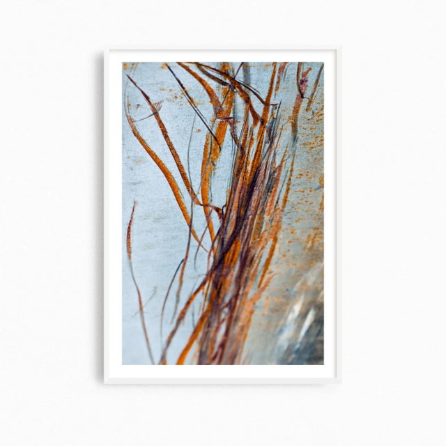 'Rust Ribbons' is a large industrial art print featuring a series of rust-colored ribbons or streaks against a textured...