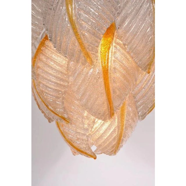 A Murano glass ceiling lamp from Mazzega, manufactured in Italy around 1960. This piece consists of several Murano glass...