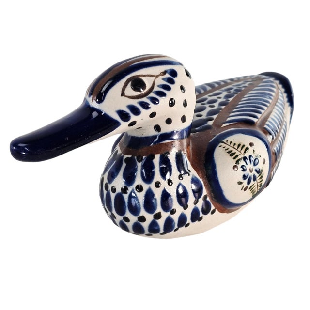 This vintage Tonalá ceramic duck represents regional folk pottery from Jalisco, Mexico, executed in hand-painted...