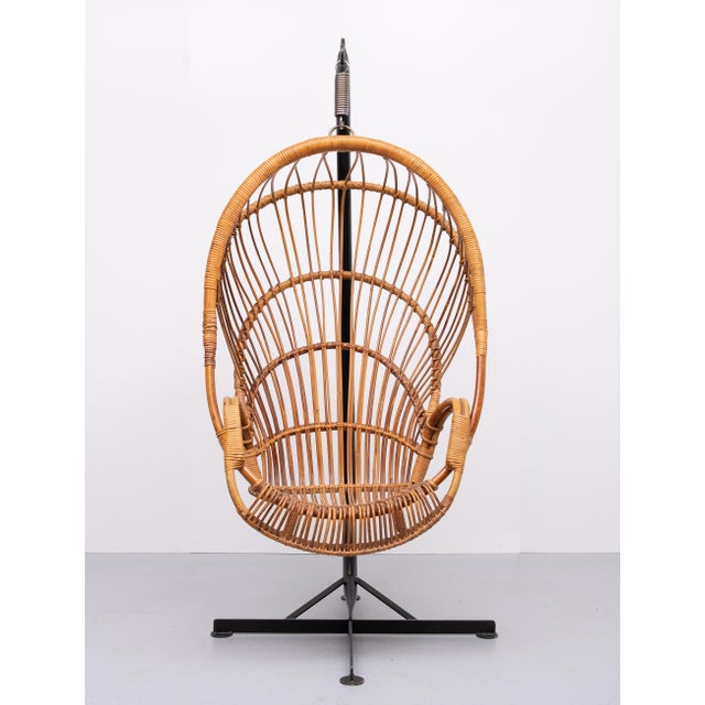 Iconic Rattan hanging Chair. Manufactured by Rohe Noordwolde. Holland Superb seating comfort. Look at that heavy Steel...