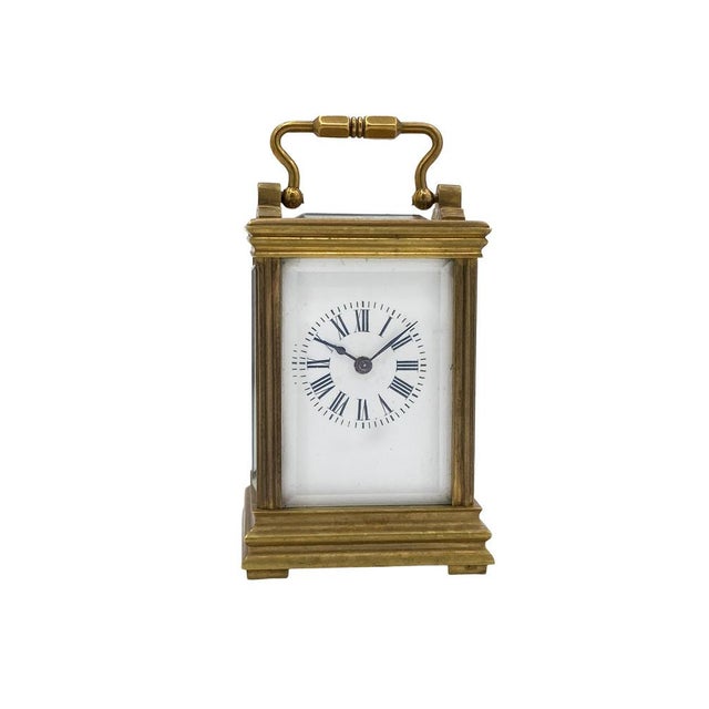 An elegant brass Cappuccina Mignon, a miniature version of the classic French pendules d'officier. The rectangular case is...