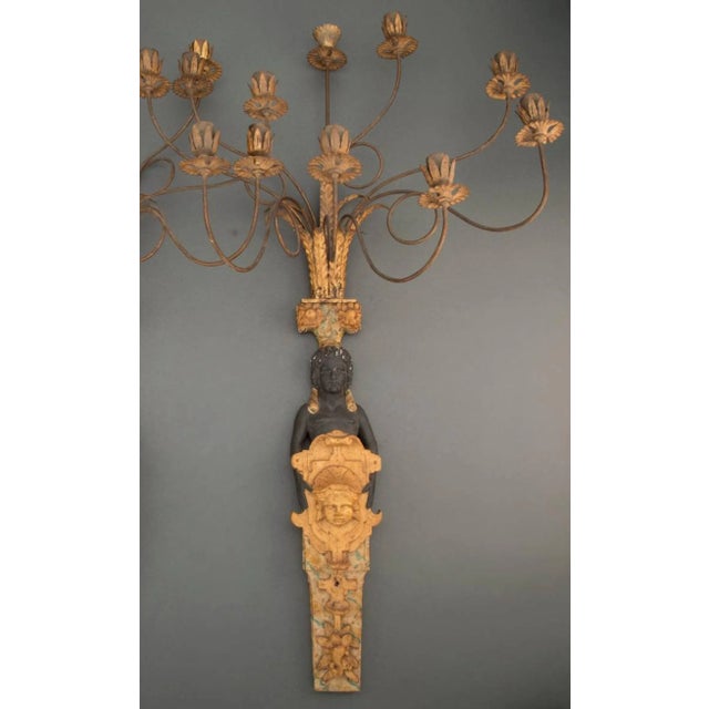 A most impressive pair of French Napoleon III Second Empire Period Egyptian Revival style gessoed, gilded and polychrome...