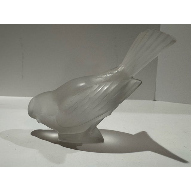 Lalique France frosted crystal Moineau Hardi sparrow figurine depicting a bird leaning forward with its head lowered and...