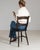 This dining chair makes its impression through dark aged wood, splat back. It was made in France during 1900s, a lineage...