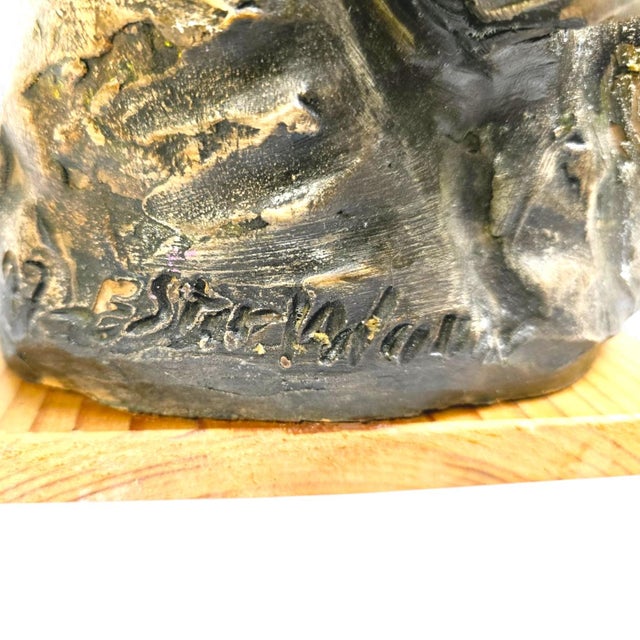 Expressive hand-sculpted ceramic figure by swedish artist ester wallin. the sculpture is crafted in textured clay with a...