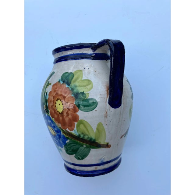 This Italian faience water jug was wheel thrown and hand painted in the 40’s Hand inscribed in the interior is “made in...