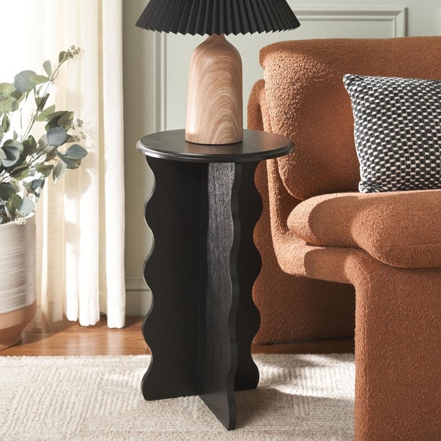 Add a touch of artistry and elegance to your home with the Lilith Wavy Accent Table in a stunning matt black finish....