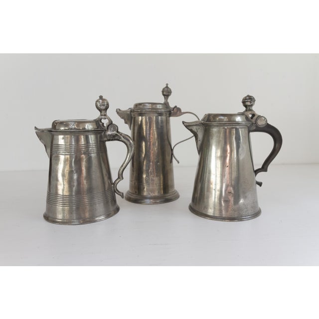 Antique Swedish Pewter Tankards, 18th century. Set of 3. Highly decorative set of three Nordic jugs or tankards with...