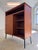 This Danish teak cabinet is an outstanding example of the functional aesthetics of mid-century design. The piece has been...
