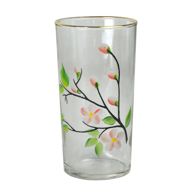 Blooming branches are charming in blush. Stylish set of eight hand-painted floral tumblers with gold rims. No maker's mark.