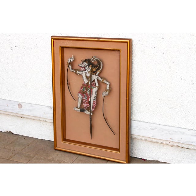 This is a lovely, rare and highly articulated artifact of Indonesian shadow theater. This antique Wayang Kulit puppet...