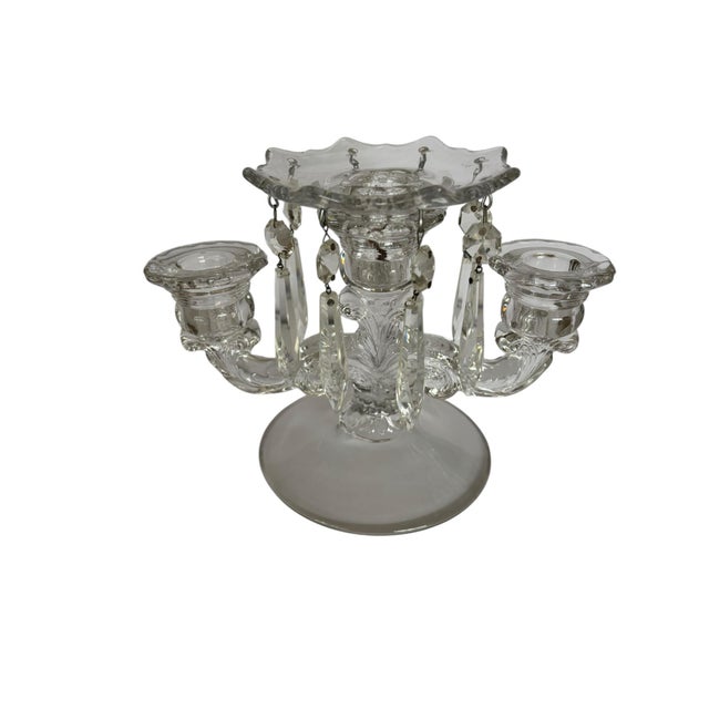 This early American elgant glass three arm candlestick holder was made by the Cambridge Glass Co. from Pittsburgh...