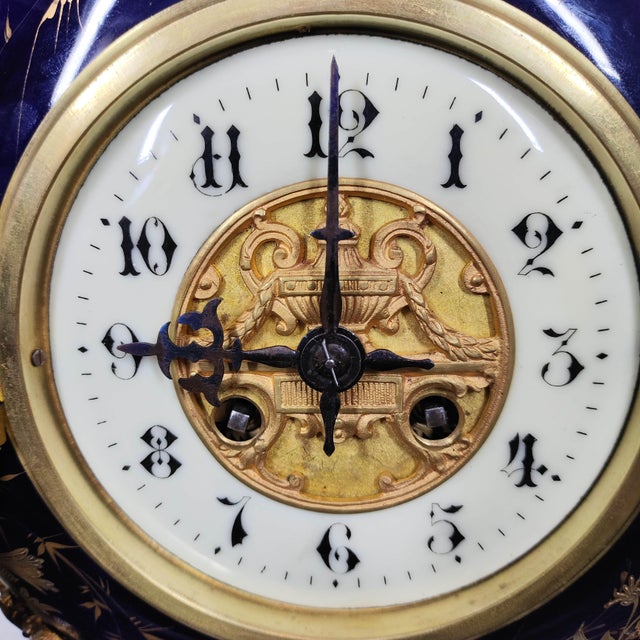A rare horological find in pristine condition. This exquisite Napoleon III-era mantel clock (c. 1870-1890) features a...