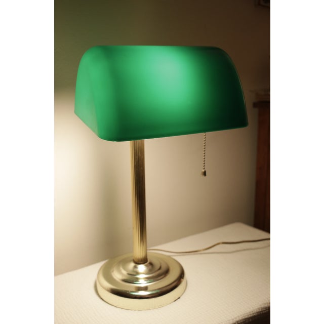 Add a touch of timeless elegance to any office or study space with this classic banker's lamp, also known as a...