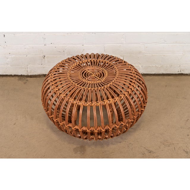 A gorgeous mid-century Organic Modern bent rattan pouf ottoman, footstool, or side table Designed by Franco Albini Italy,...