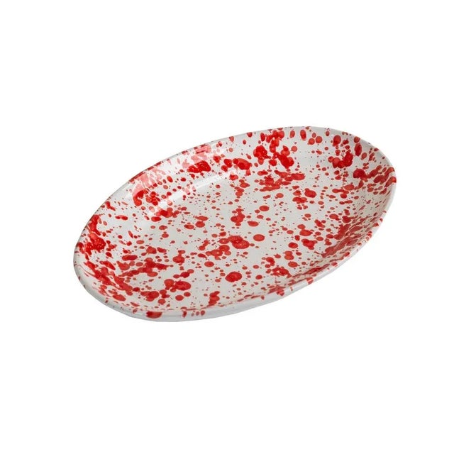 This hand-painted ceramic platter is great for serving your favorite dishes or looks great as decor. Varying hues of red...