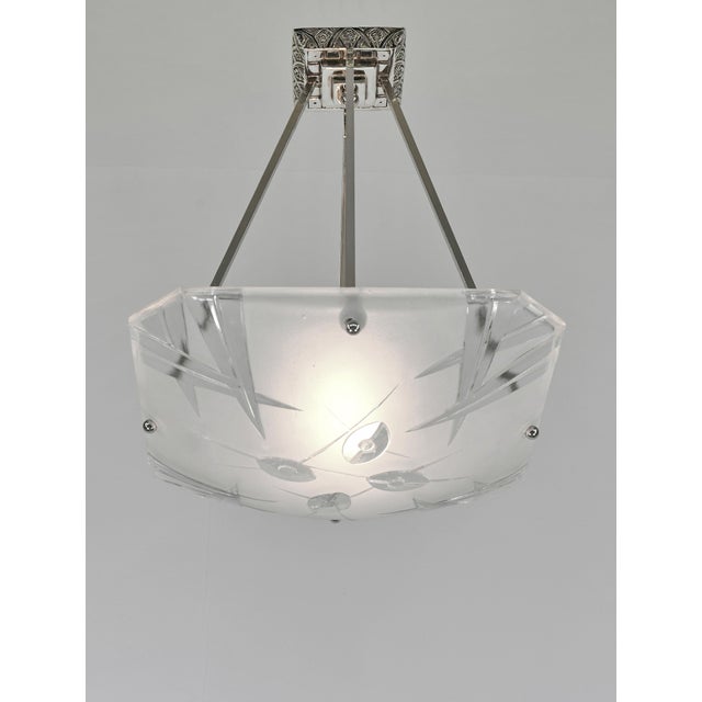 Degué A signed French art deco pendant chandelier around 1930-35 in nickel plated bronze or solid brass. The mounting...
