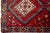 Textile Vintage Persian Hand-Knotted Wool Rug Featuring a Red Field and a Tribal Design For Sale - Image 7 of 10