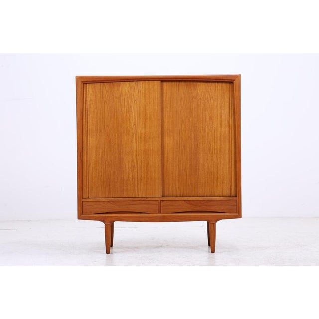 Vintage wardrobe by Axel Christensen for Aco Møbler with two sliding doors and an exceptionally well-designed interior....