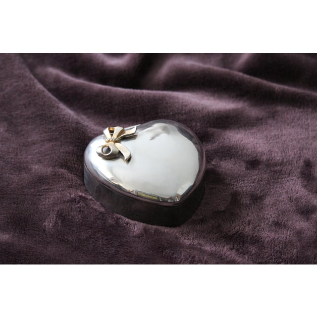 Silver jewelry box Heart shape Gold bow decor Red velvet interior Silver plate metal. Dimensions: Height 1.5" / 4 cm Width...