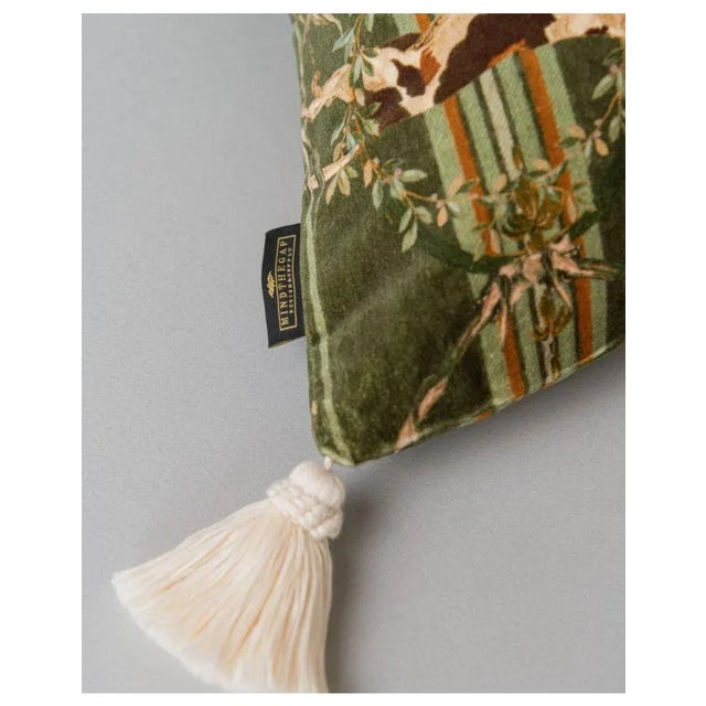 A pack of agile hounds bound across this handsome cushion, which is crafted from the spirited MOUNTAIN DOGS cotton velvet...