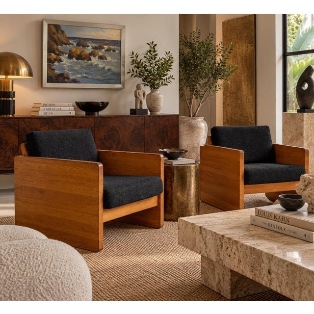 Striking pair of 1970s Mid-Century Modern lounge chairs featuring a bold architectural cube-form design with substantial...