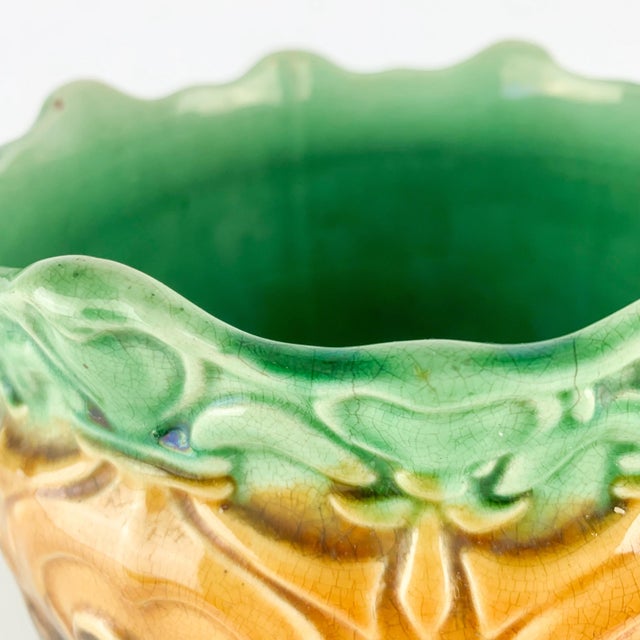 Stunning vintage pottery jardiniere / planter. Incredible blended green to brown glaze. Love the scalloped heart edge....