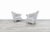 Crafted in the United States during the 1980s, this striking pair of vintage Hollywood Regency lounge chairs captures the...