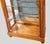 This is a handsome pair of neo-classical Biedermeier style display cabinets by Hickory White. They are carved walnut and...