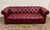 This is a stunning and rare vintage tufted leather Chesterfield sofa by Ethan Allen in an oxblood red color. Solid,...