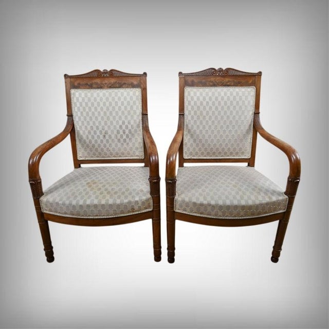 Exquisitely crafted, these early 19th-century armchairs exemplify the noble aesthetic of the Empire style. The solid...