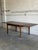 This beautiful expandable dining table features a minimalist rectangular top profile supported by sleek square tapered...