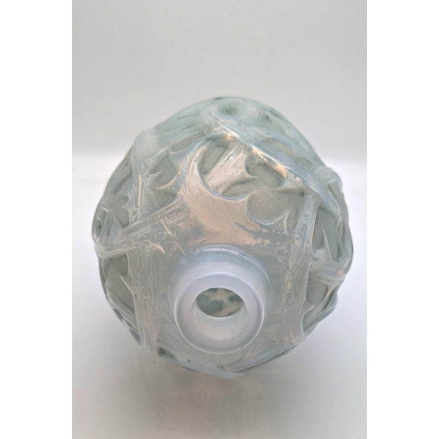 Elevate your collection with this exquisite and highly sought-after Lalique vase, model 'Ronces'. Designed by René Lalique...