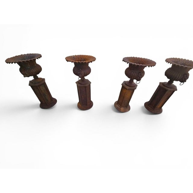 Exceptional set of four monumental garden urns crafted in iron and dating from the 1960s. Made in Italy, these impressive...