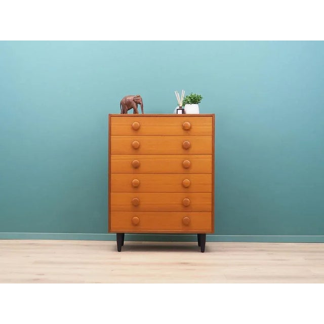 The chest of drawers was made in the 1960s, Danish production. The structure is covered with teak veneer. Legs and handles...